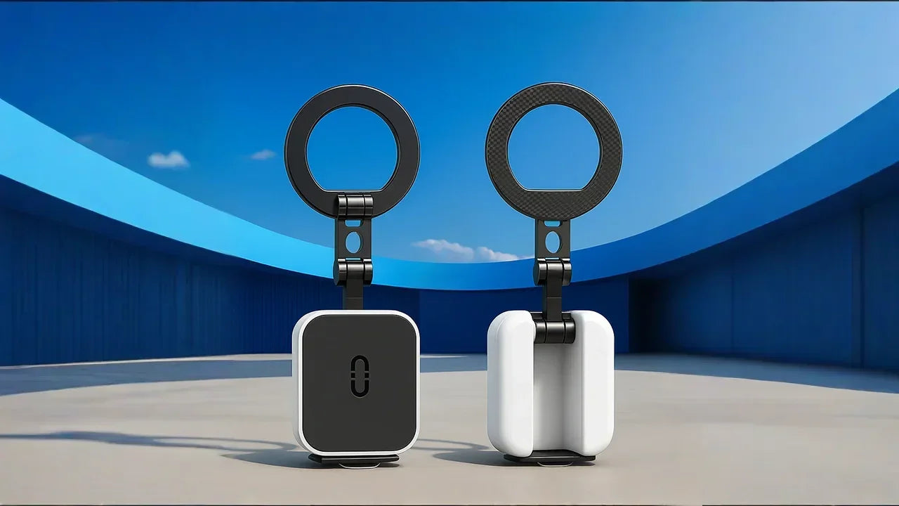 A side-by-side comparison of the two color options for the foldable phone stand, showing the all-black version next to the white version with black accents, set against a modern blue background.